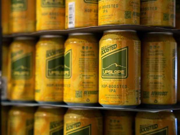 Founder Matt Cutter says the BevBoost plastic widget extends his IPA's shelf life by 60 days. (Hayden Kim/BusinessDen)